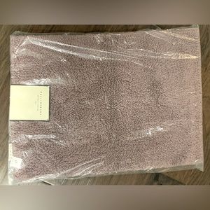 New with tags Pottery Barn rugs, (2) 17x24, 100% cotton, Color- lilac-